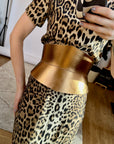 Aria Margo gold Italian leather corset belt with an hourglass silhouette worn over a leopard print dress