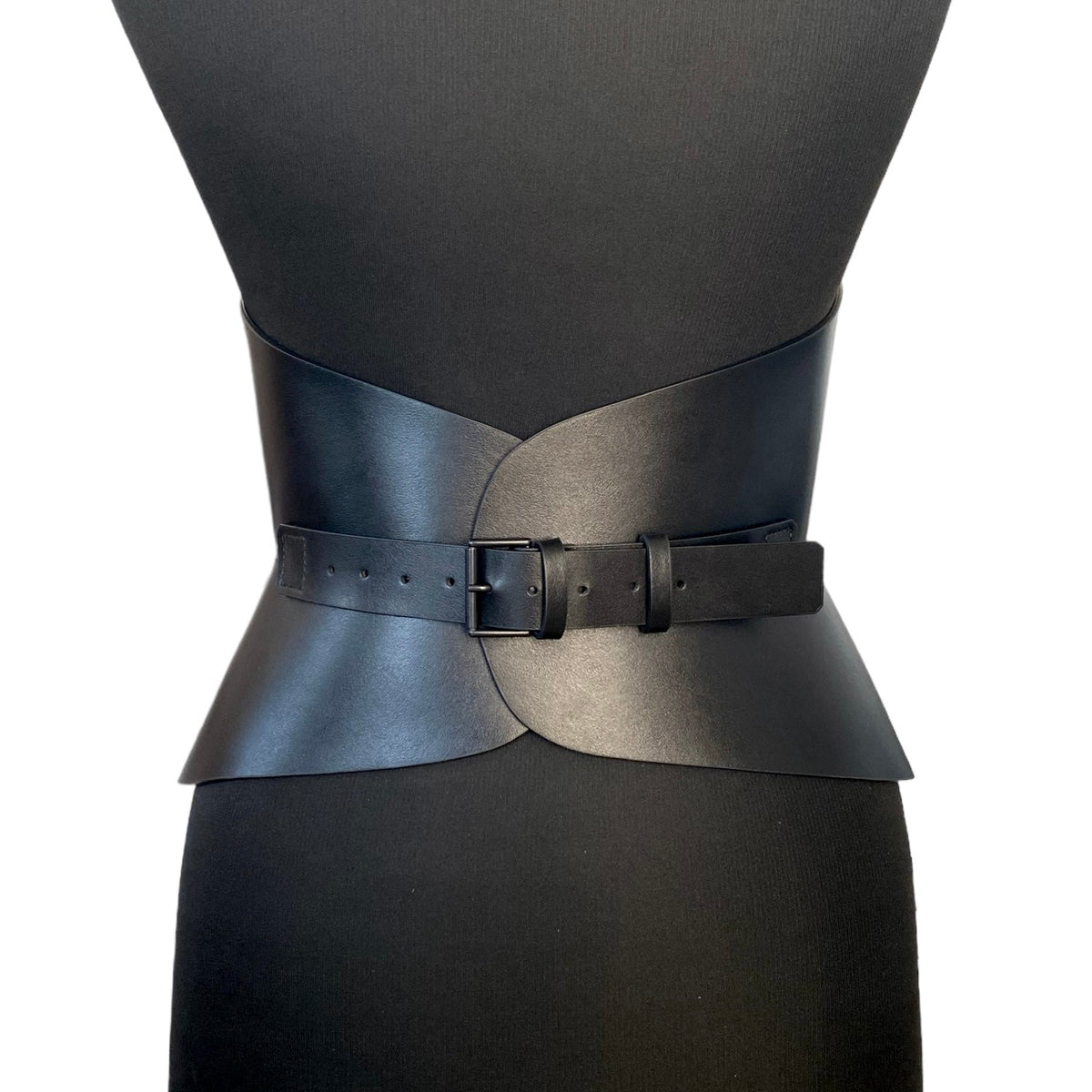 Aria Margo Audrey black Italian leather corset belt with a sleek buckle worn on a mannequin torso.