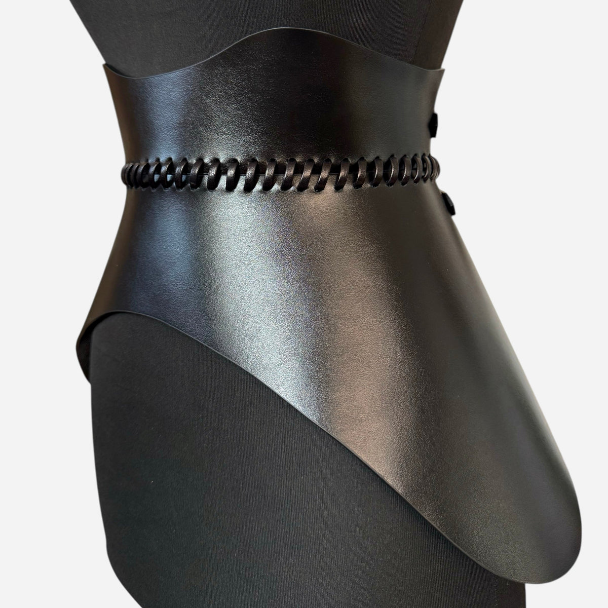 Aria Margo black leather corset belt with sculpted hourglass shape and hand-worked leather lacing detail
