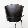 Aria Margo black Italian leather corset belt with wrap-around cord lacing and side loops on a white background.