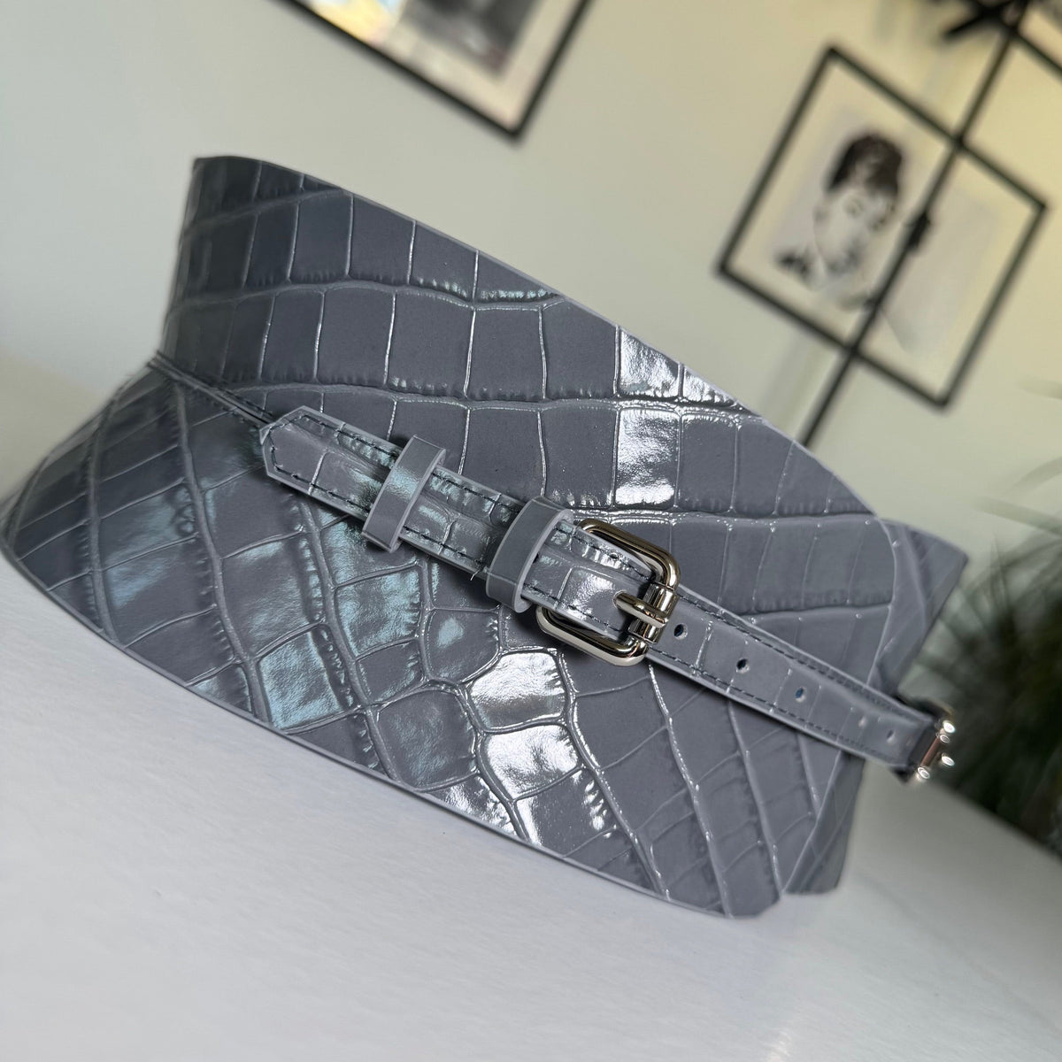 Aria Margo gray croc-embossed leather corset belt with a polished silver buckle and structured waist design.