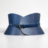 Aria Margo navy blue Italian leather hourglass corset belt with a gold-tone buckle on a light grey background.