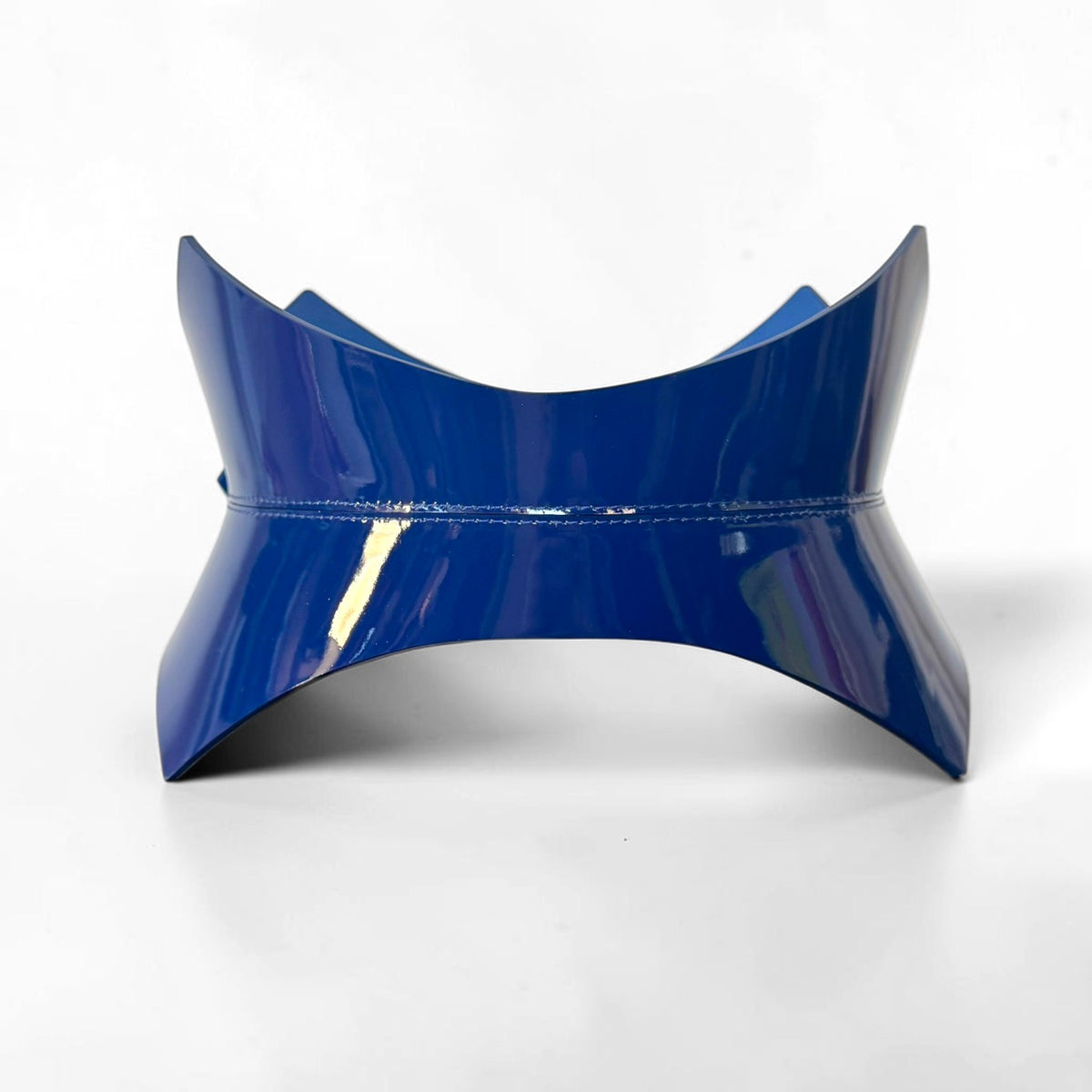 Aria Margo navy blue patent leather corset belt with a high-shine finish and pointed structural design.