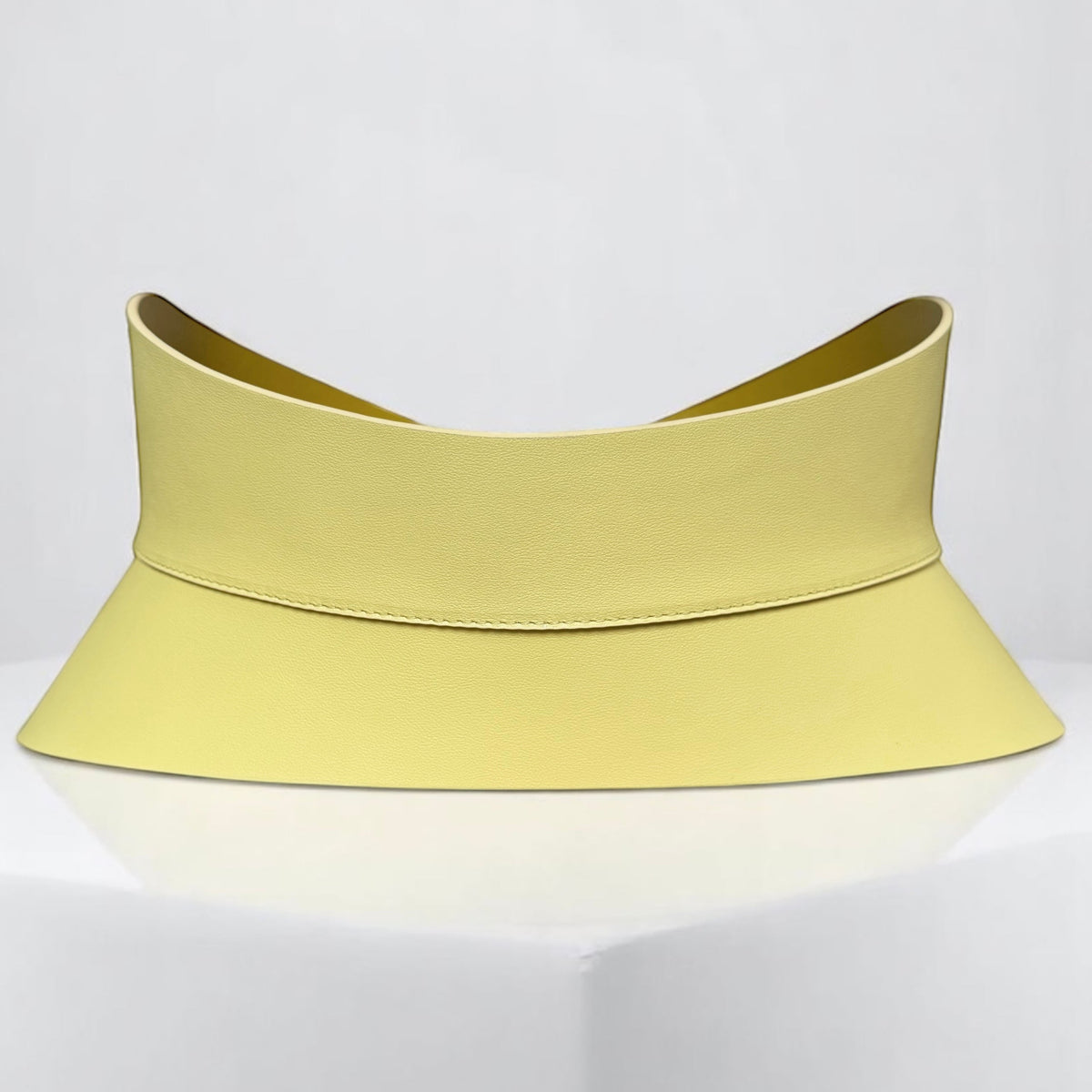 Aria Margo pale yellow leather corset belt with an hourglass silhouette for waist definition.