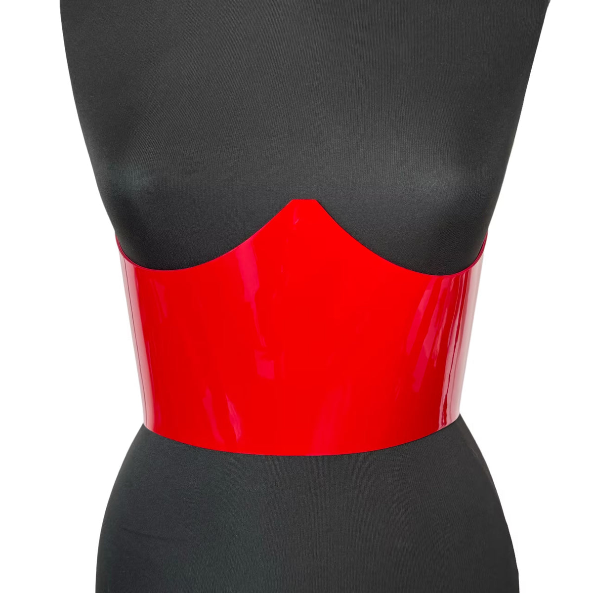 Aria Margo red patent leather under-bust belt with a high-shine finish on a black mannequin torso.