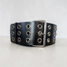 Aria Margo Test black leather coat belt featuring three rows of silver eyelets and a double-prong buckle.